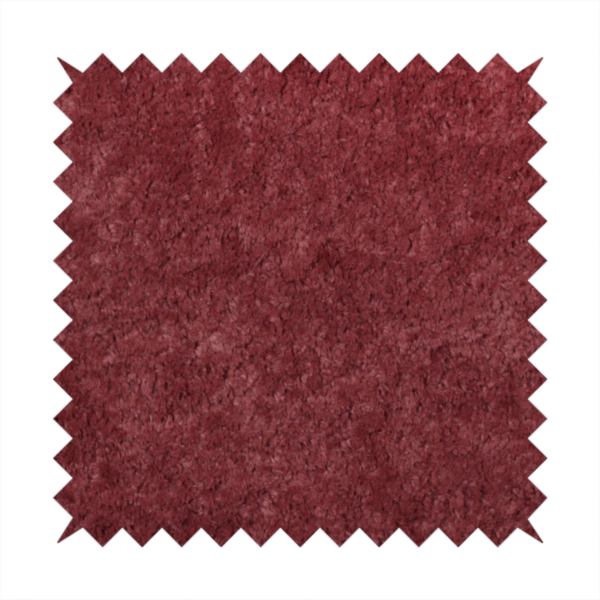 A plush, deep burgundy fabric featuring a dense, uniform, and textured pile.
