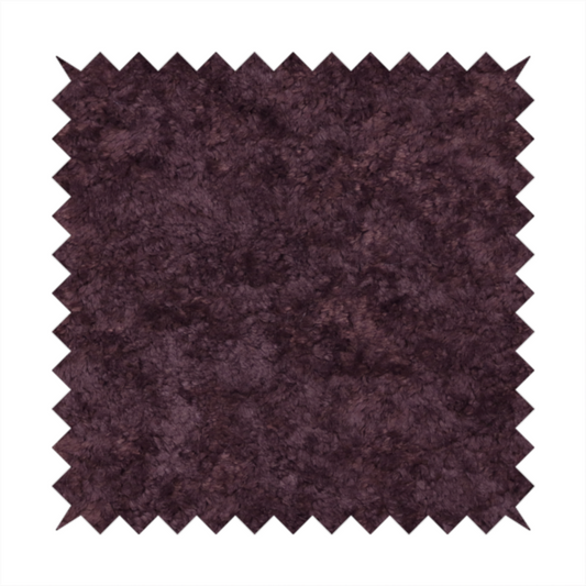 A plush, deep plum fabric featuring a dense, uniform, and textured pile.