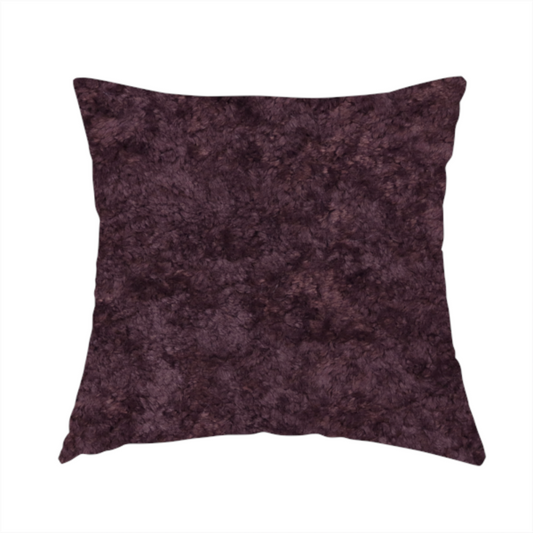 The fabric used to create these handmade cushions is a plush, deep plum fabric featuring a dense, uniform, and textured pile.