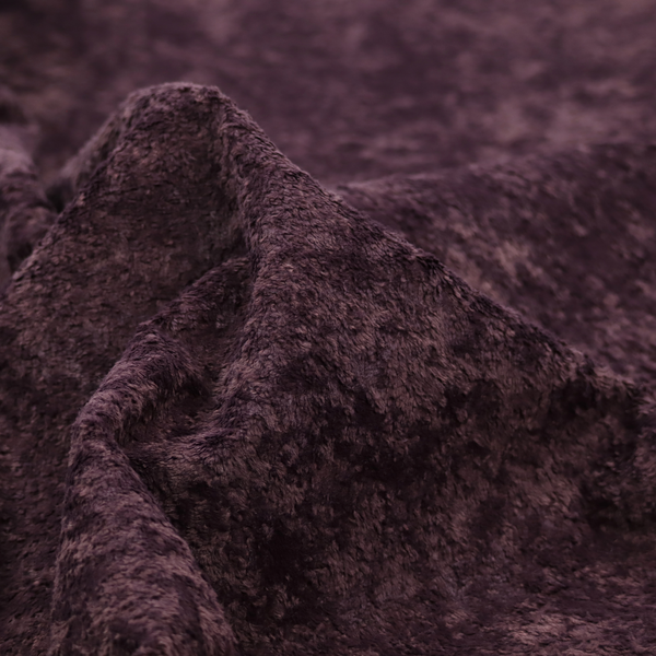 A plush, deep plum fabric featuring a dense, uniform, and textured pile.