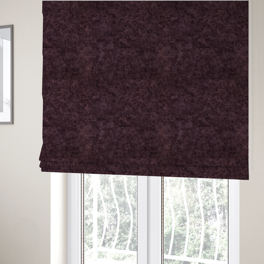 The fabric used to create these Roman blinds is a plush, deep plum fabric featuring a dense, uniform, and textured pile.