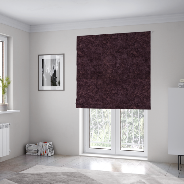 The fabric used to create these Roman blinds is a plush, deep plum fabric featuring a dense, uniform, and textured pile.
