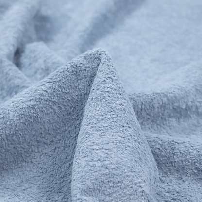 A soft, light blue fabric with a dense, uniform, and plush pile.