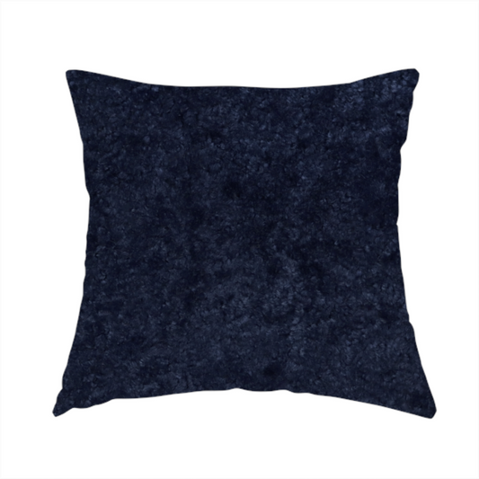 The fabric used to create this handmade cushion is a soft, navy blue fabric featuring a dense, uniform, plush pile like thick fleece.