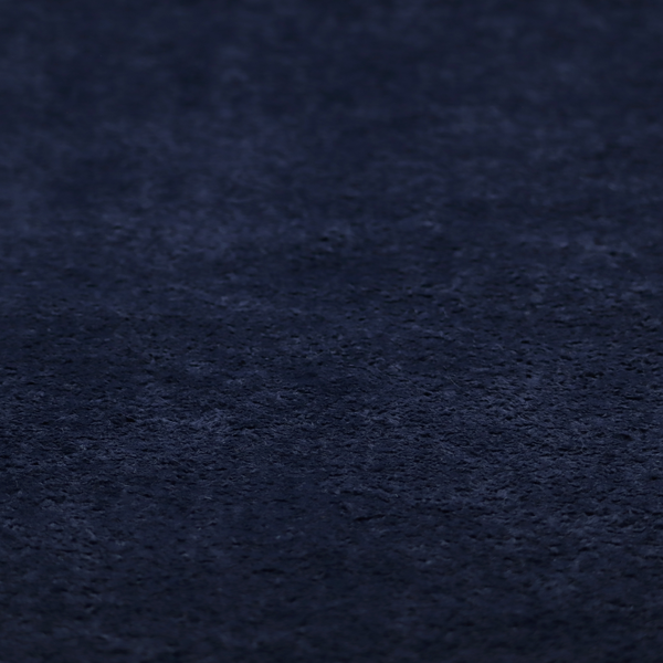 A soft, navy blue fabric featuring a dense, uniform, plush pile like thick fleece.