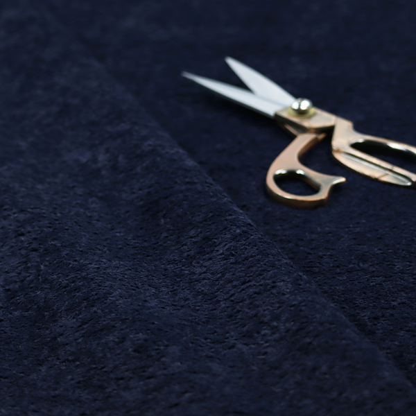 A soft, navy blue fabric featuring a dense, uniform, plush pile like thick fleece.