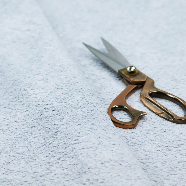 A soft, pale blue fabric with a dense, uniform, and plush pile.