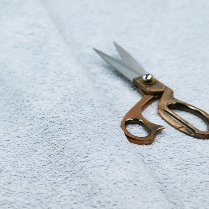 A soft, pale blue fabric with a dense, uniform, and plush pile.