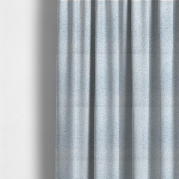 the fabric used to create these made-to-measure curtains is a soft, pale blue fabric with a dense, uniform, and plush pile.