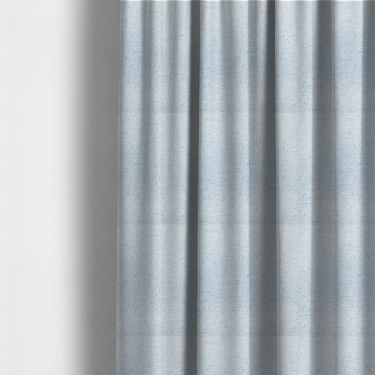 the fabric used to create these made-to-measure curtains is a soft, pale blue fabric with a dense, uniform, and plush pile.
