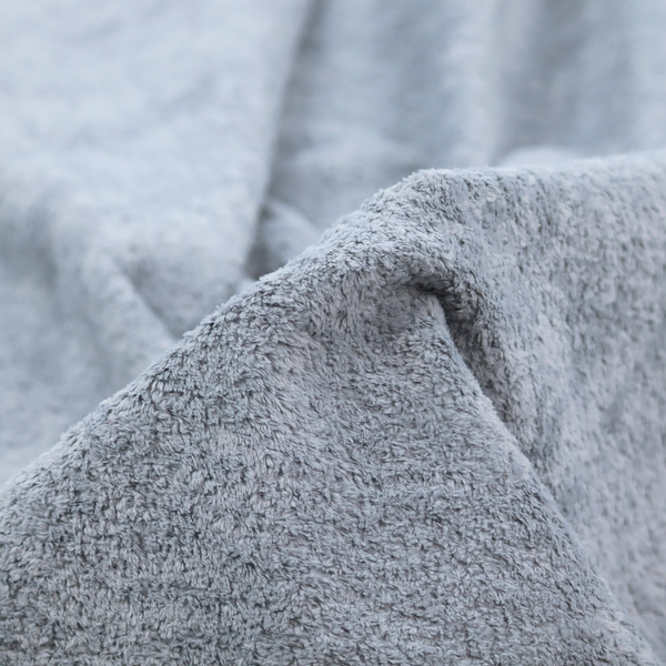 A soft greyish-blue fabric with a dense, uniform, textured pile like thick fleece.