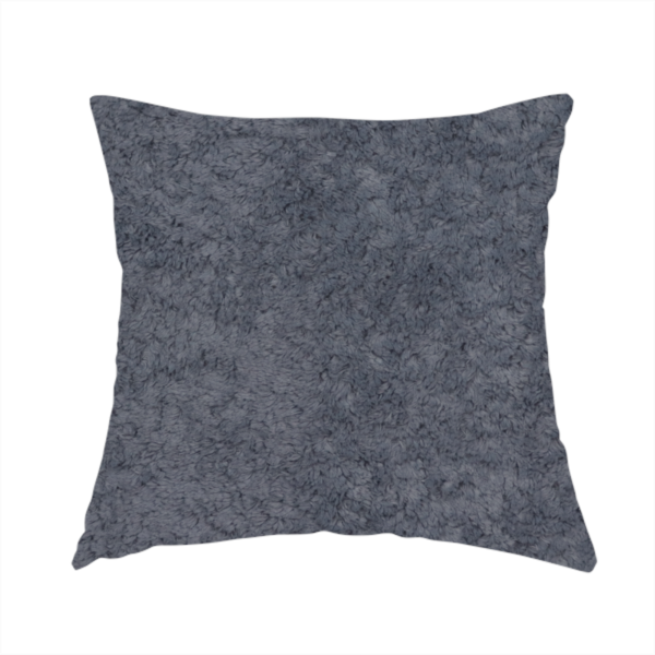 The fabric used to create this handmade cushion is a plush shark grey fabric with a dense, uniform, textured pile like thick fleece.