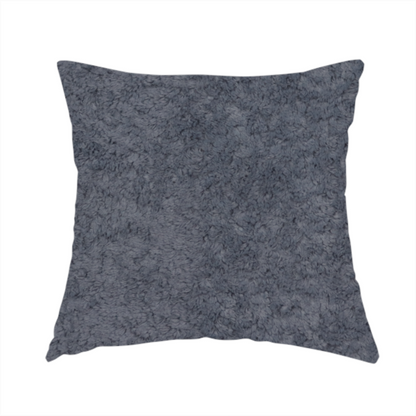 The fabric used to create this handmade cushion is a plush shark grey fabric with a dense, uniform, textured pile like thick fleece.
