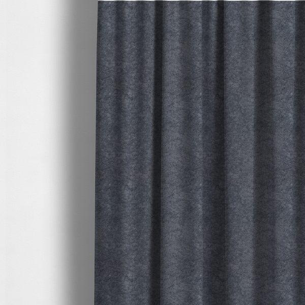 The fabric used to create these made-to-measure curtains is a plush shark grey fabric with a dense, uniform, textured pile like thick fleece.