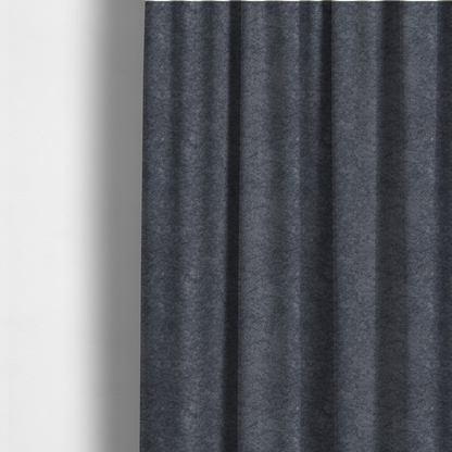 The fabric used to create these made-to-measure curtains is a plush shark grey fabric with a dense, uniform, textured pile like thick fleece.