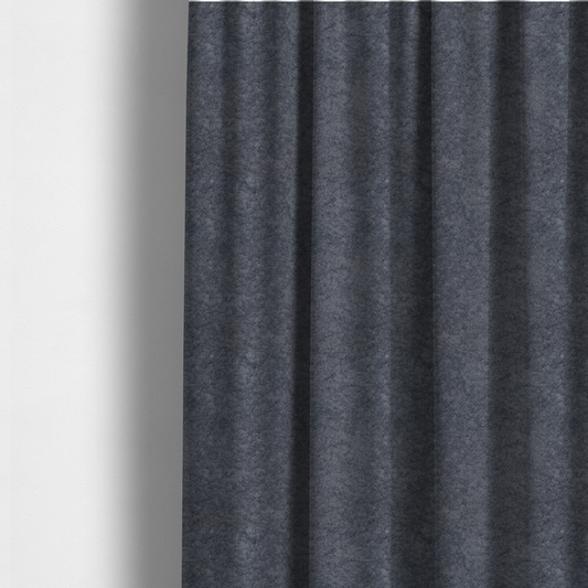 The fabric used to create these made-to-measure curtains is a plush shark grey fabric with a dense, uniform, textured pile like thick fleece.