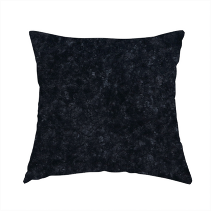The fabric used to create this handmade cushion is a plush charcoal fabric with a dense, uniform, textured pile like thick fleece.