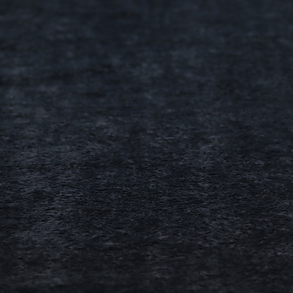 A plush charcoal fabric with a dense, uniform, textured pile like thick fleece.