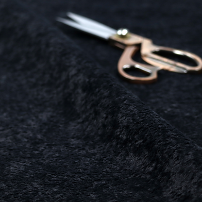 A plush charcoal fabric with a dense, uniform, textured pile like thick fleece.