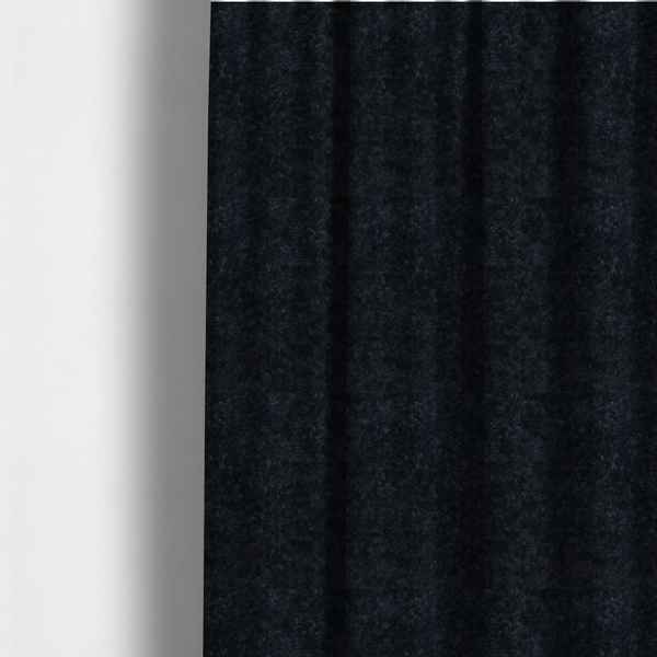 The fabric used to create these made-to-measure curtains is a plush charcoal fabric with a dense, uniform, textured pile like thick fleece.