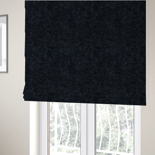 The fabric used to create these Roman blinds is a plush charcoal fabric with a dense, uniform, textured pile like thick fleece.