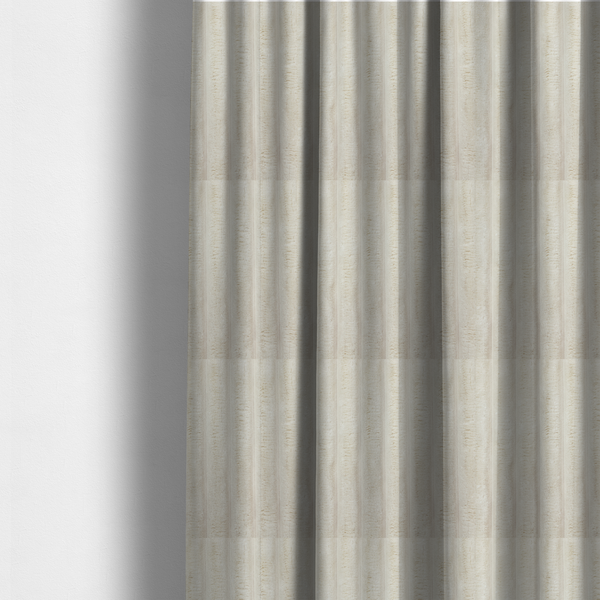 The fabric used to create these made-to-measure curtains is a detailed view of a light beige or cream-coloured textile featuring a repeating, vertical channel-tufted pattern. The material alternates between soft, high-pile plush bands and thin, compressed vertical lines.