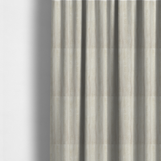 The fabric used to create these made-to-measure curtains is a detailed view of a light beige or cream-coloured textile featuring a repeating, vertical channel-tufted pattern. The material alternates between soft, high-pile plush bands and thin, compressed vertical lines.