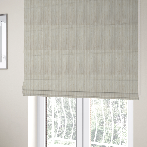 The fabric used to create these Roman blinds is a detailed view of a light beige or cream-coloured textile featuring a repeating, vertical channel-tufted pattern. The material alternates between soft, high-pile plush bands and thin, compressed vertical lines.