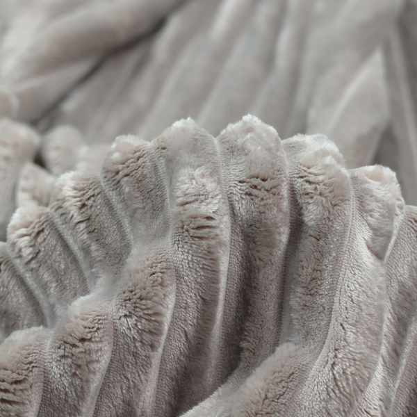 A grey textile featuring a repeating, vertical channel-tufted pattern that alternates between soft, high-pile bands and narrow, flat lines.