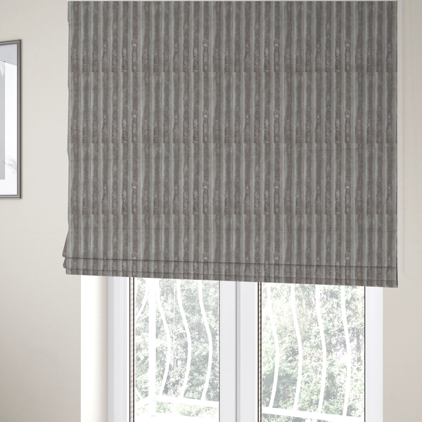 The fabric used to create this Roman blind is a grey textile featuring a repeating, vertical channel-tufted pattern that alternates between soft, high-pile bands and narrow, flat lines.