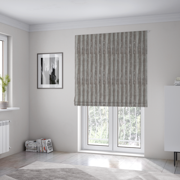 The fabric used to create this Roman blind is a grey textile featuring a repeating, vertical channel-tufted pattern that alternates between soft, high-pile bands and narrow, flat lines.
