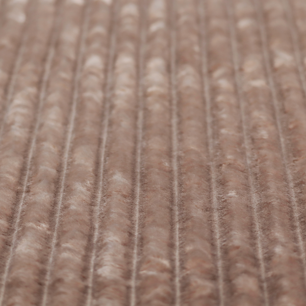 A warm, taupe-coloured textile featuring a repeating, vertical channel-tufted pattern that alternates between soft, high-pile bands and narrow, flat lines.