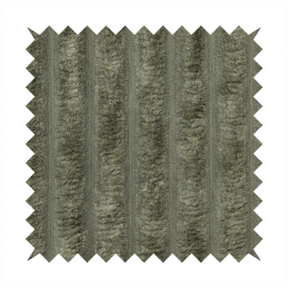 A muted, olive green textile featuring a repeating, vertical channel-tufted pattern that alternates between soft, high-pile bands and narrow, flat lines.