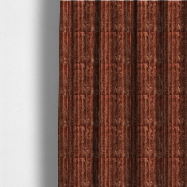 The fabric used to create these made-to-measure curtains is a orange rust, vertically ribbed, channel-tufted plush fabric with a soft, fuzzy texture.