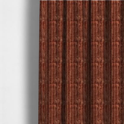 The fabric used to create these made-to-measure curtains is a orange rust, vertically ribbed, channel-tufted plush fabric with a soft, fuzzy texture.