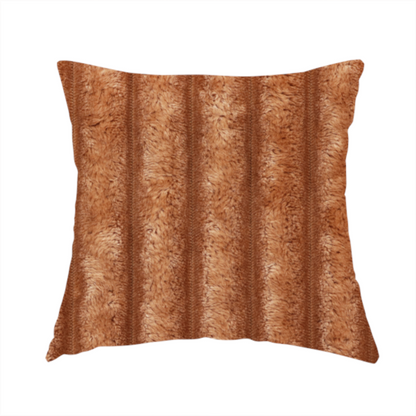 The fabric used to create this handmade cushion is a tanned copper, vertically ribbed, channel-tufted plush fabric.