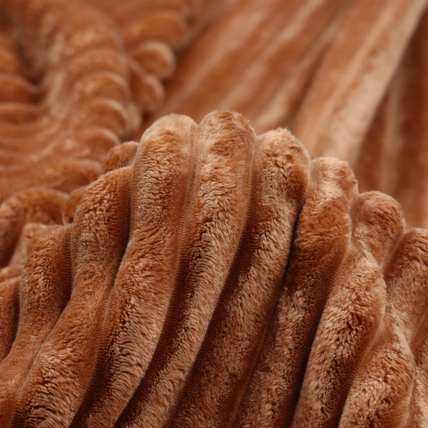 A tanned copper, vertically ribbed, channel-tufted plush fabric.