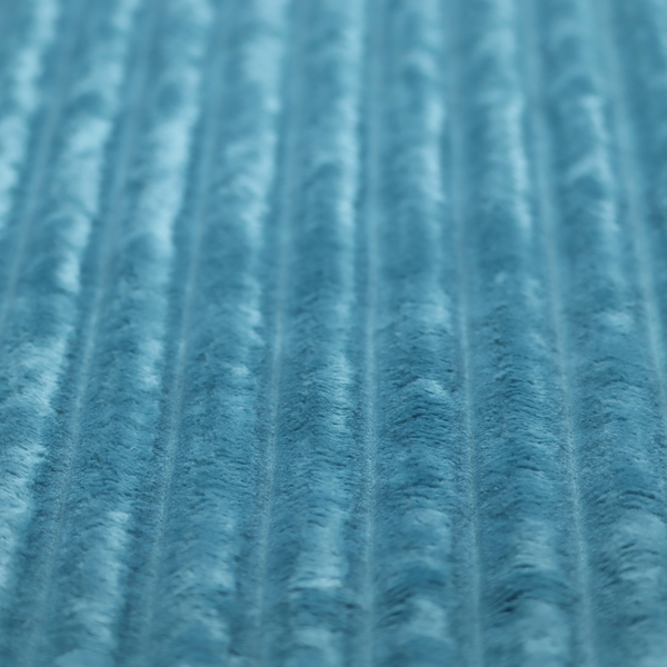 The fabric is a saturated, cool-toned teal or turquoise blue.