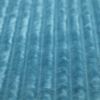 The fabric is a saturated, cool-toned teal or turquoise blue.