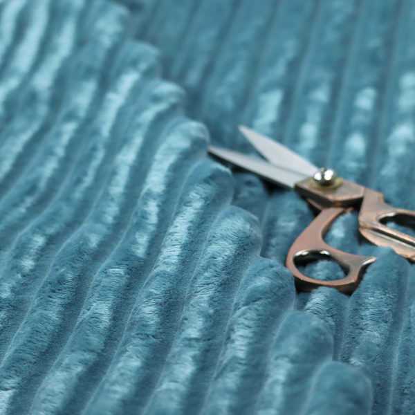 The fabric is a saturated, cool-toned teal or turquoise blue.