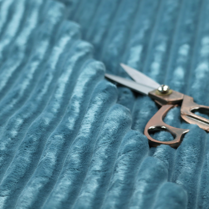 The fabric is a saturated, cool-toned teal or turquoise blue.