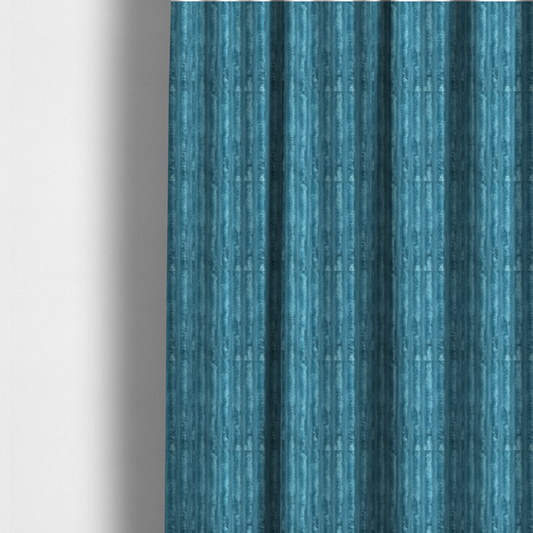 The fabric used to create these made-to-measure curtains is a saturated, cool-toned teal or turquoise blue.