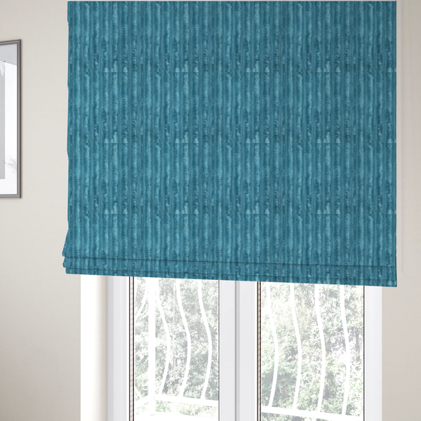 The fabric used to create these Roman blinds fabric is a saturated, cool-toned teal or turquoise blue.