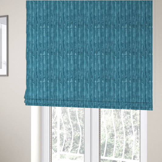 The fabric used to create these Roman blinds fabric is a saturated, cool-toned teal or turquoise blue.