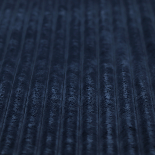 A navy blue, vertically ribbed plush fabric.