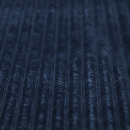 A navy blue, vertically ribbed plush fabric.
