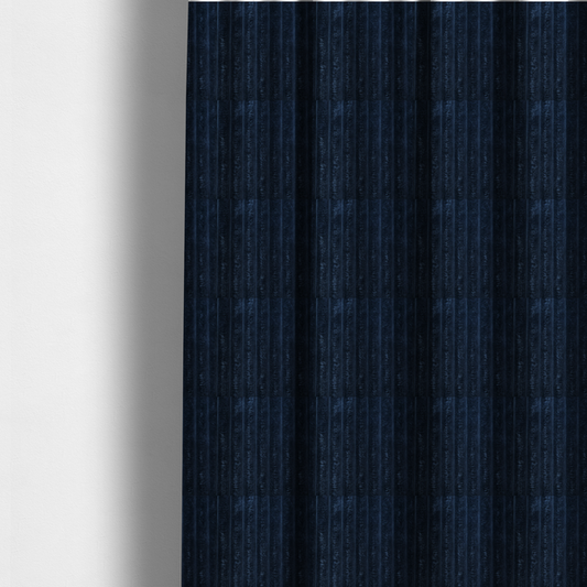 The fabric used to create these made-to-measure curtains is a navy blue, vertically ribbed plush fabric.
