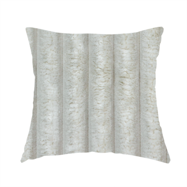 The fabric used to create this handmade cushion is a light grey, vertically ribbed, channel-tufted plush fabric.
