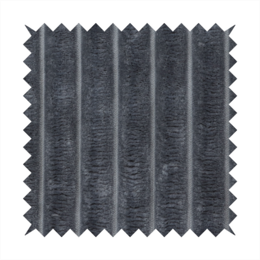 A charcoal grey, vertically ribbed, channel-tufted plush fabric.