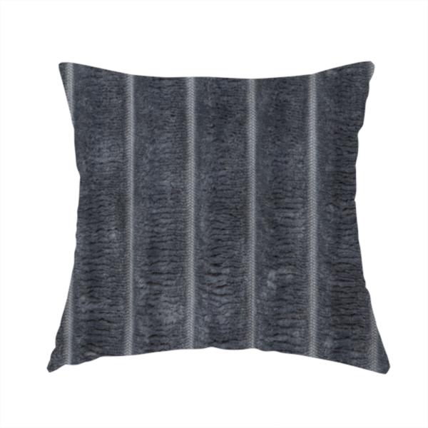 The fabric used to create this handmade cushion is a charcoal grey, vertically ribbed, channel-tufted plush fabric.